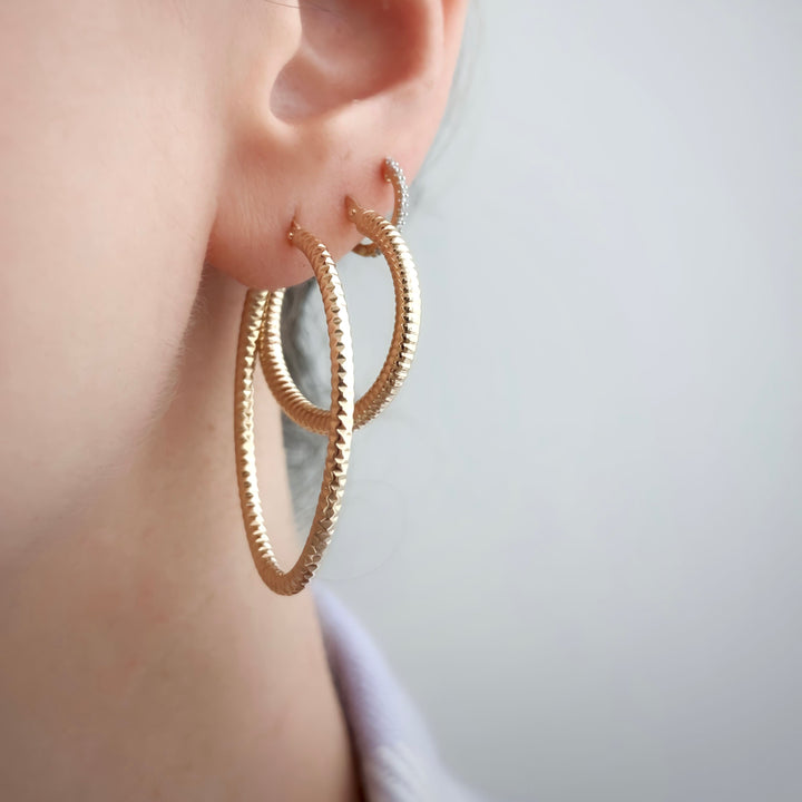 Carved gold hoops